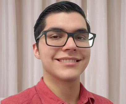 Andrew Hayes, CRE Insurance agent and broker, smiling and wearing glasses.